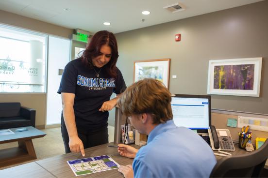 Two students looking at a campus map