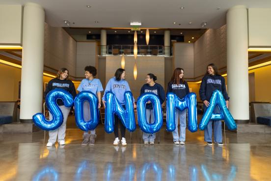 Group of sudents holding letter balloons that spell Sonoma