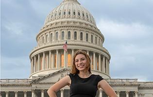 student in front of U.S. capital