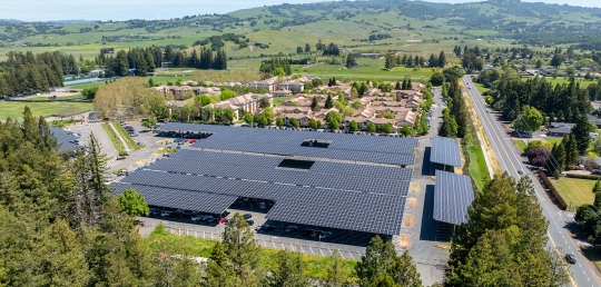 SSU’s solar array project, estimated to provide one-third of the campus with clean, renewable electricity, is the most ambitious initiative in the SSU Climate Action Plan and is projected to save the campus $6 million over 30 years. aerial view of solar panels over parking lot